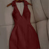 Front view of short maroon dress with sleeveless collared v neck, fitted bodice and mini length silhouette for a sleek look.
