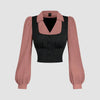 Pink and black long sleeve top featuring a contrast turndown collar and ruched bust design.