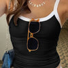 A women is wearing black tank top featuring a fitted design, ribbed texture, and contrast white trim for lightweight, all-day comfort.