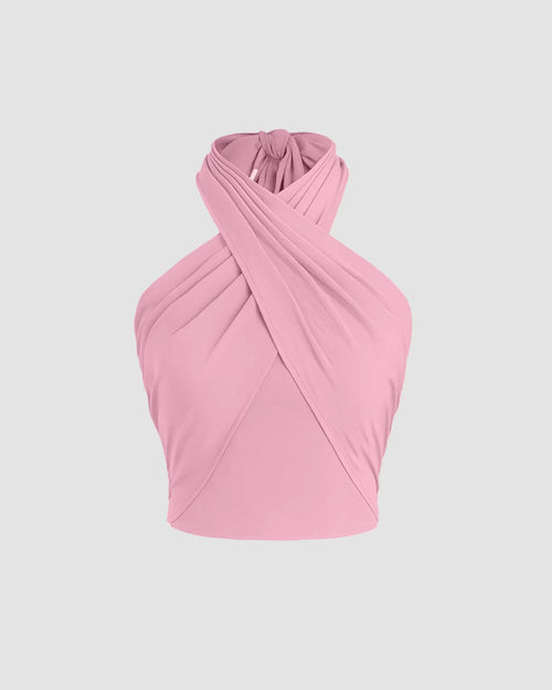 Front view of Stylish dark pink crop top with a cross halter design, showcasing an open back for a trendy vibe