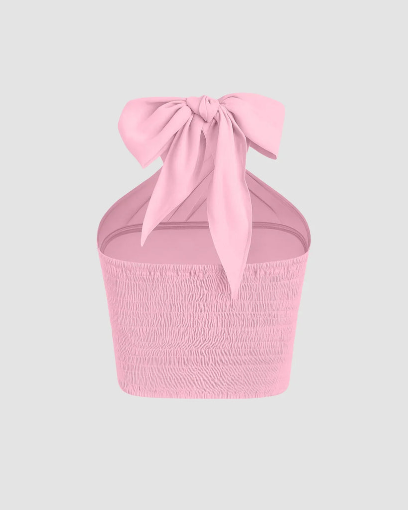 Back view of Stylish dark pink crop top with a cross halter design, showcasing an open back for a trendy vibe