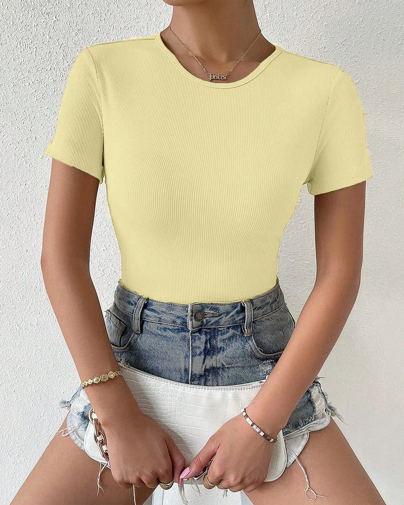 a woman in a yellow top with a white bow, showcasing the Cut Out Bow Back Short Sleeve Top design.