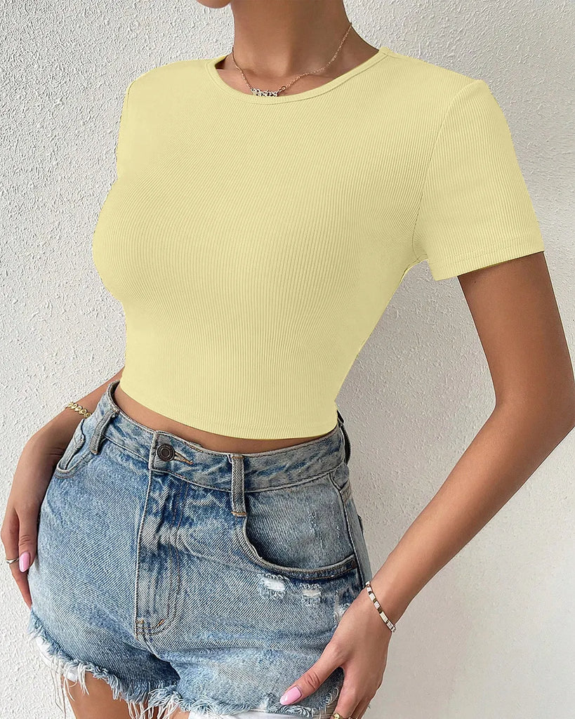 a woman in a yellow top with a white bow, showcasing the Cut Out Bow Back Short Sleeve Top design.