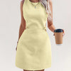 Front view of french vanilla sleeveless mini dress with side cut out detail and clean silhouette, stylish cut out dress.