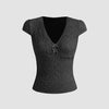 Cute black V-neck tee featuring delicate lace trim and a bow, perfect for adding femininity to casual outfits