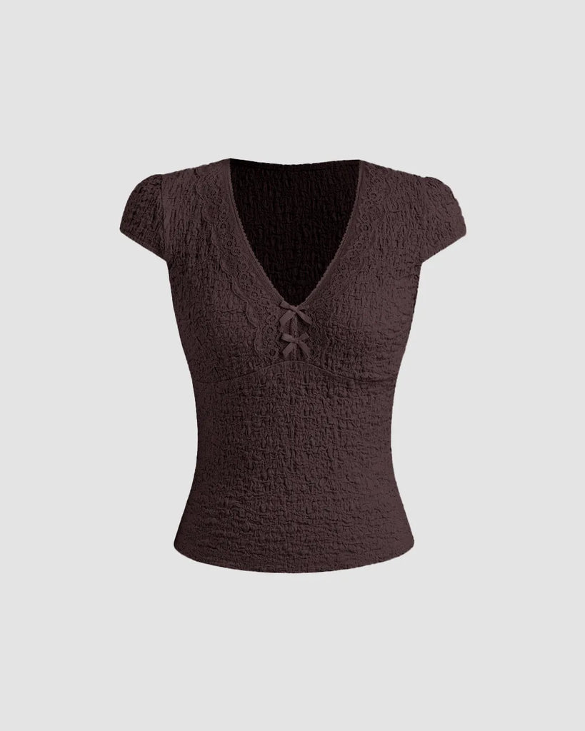 Cute brown V-neck tee featuring delicate lace trim and a bow, perfect for adding femininity to casual outfits
