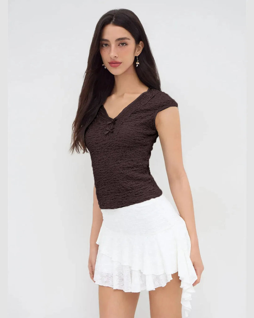 Woman wearing Cute brown V-neck tee featuring delicate lace trim and a bow, perfect for adding femininity to casual outfits
