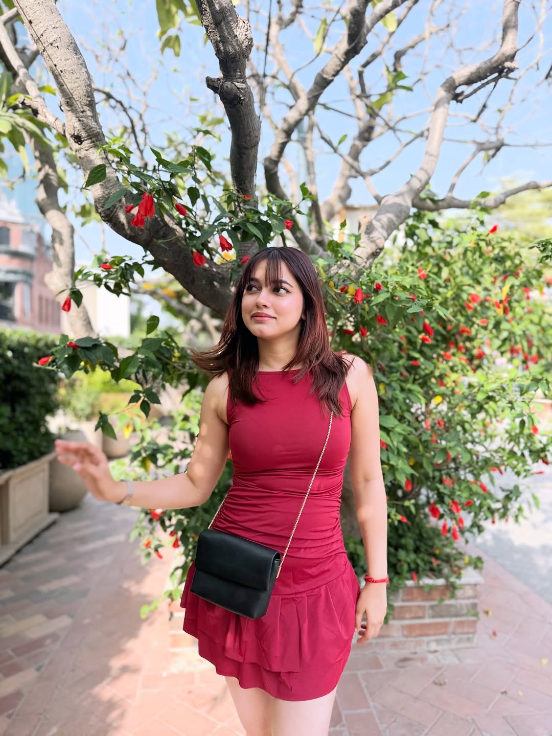 Customer photo 2 of Sleeveless Mini Dress with Ruched Waist and Flare Hem in Burgundy