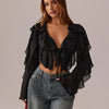 Front view of Black sheer mesh crop top with deep V-neck and long sleeves, slim-fit design with layered ruffle detail