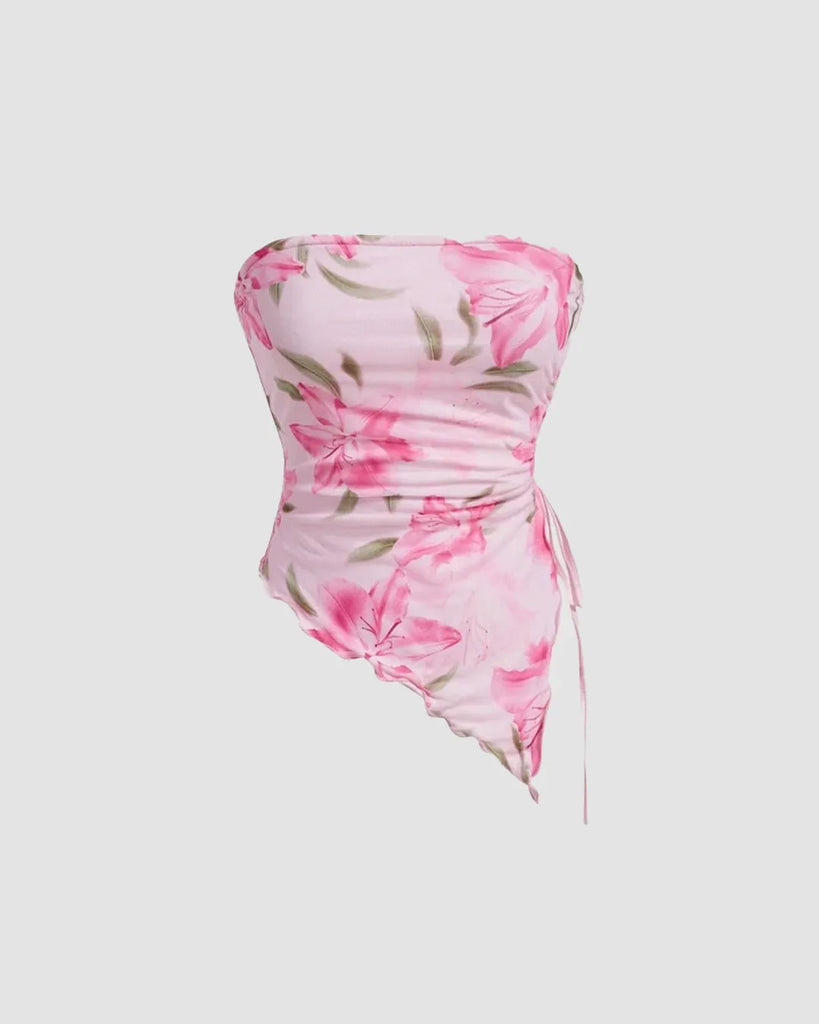 Dusty pink floral asymmetrical dress with a ruched tube top design, perfect for a stylish summer look