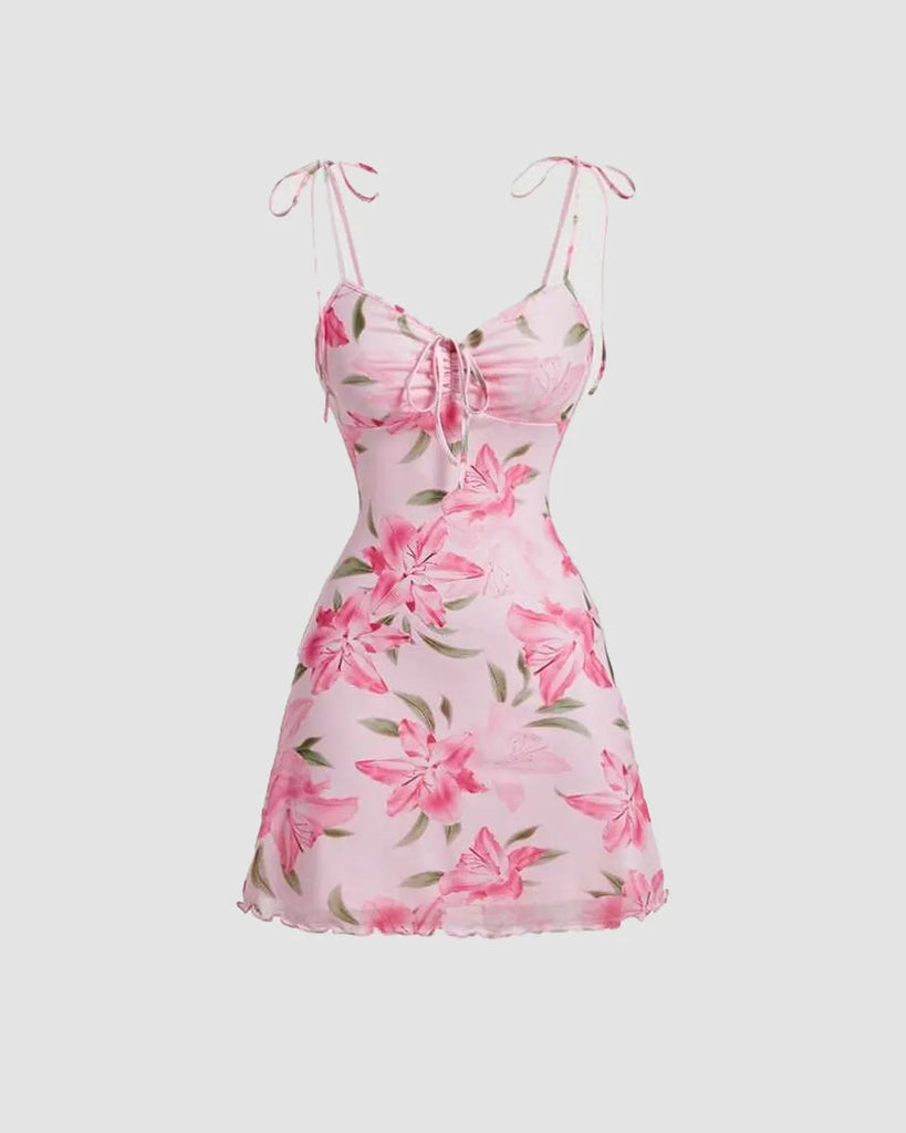 Dusty pink floral mini dress featuring a ruched design, ideal for casual outings or special occasions.