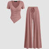 Dusty pink wrap v-neck top paired with wide leg pants in a coordinated set, showcasing a stylish and comfortable outfit.