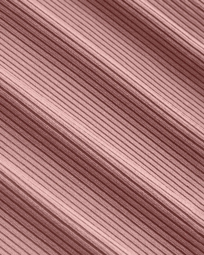 Closed view of a Dusty pink wrap v-neck top paired with wide leg pants in a coordinated set, showcasing a stylish and comfortable outfit.