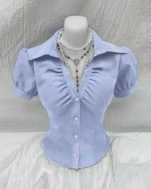 Fitted shirt with a white button at the front, featuring ruched detailing and puff sleeves
