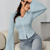 Front view of Sky blue top with ribbed texture, button-down front and flared long sleeves offering a soft fitted silhouette for casual wear