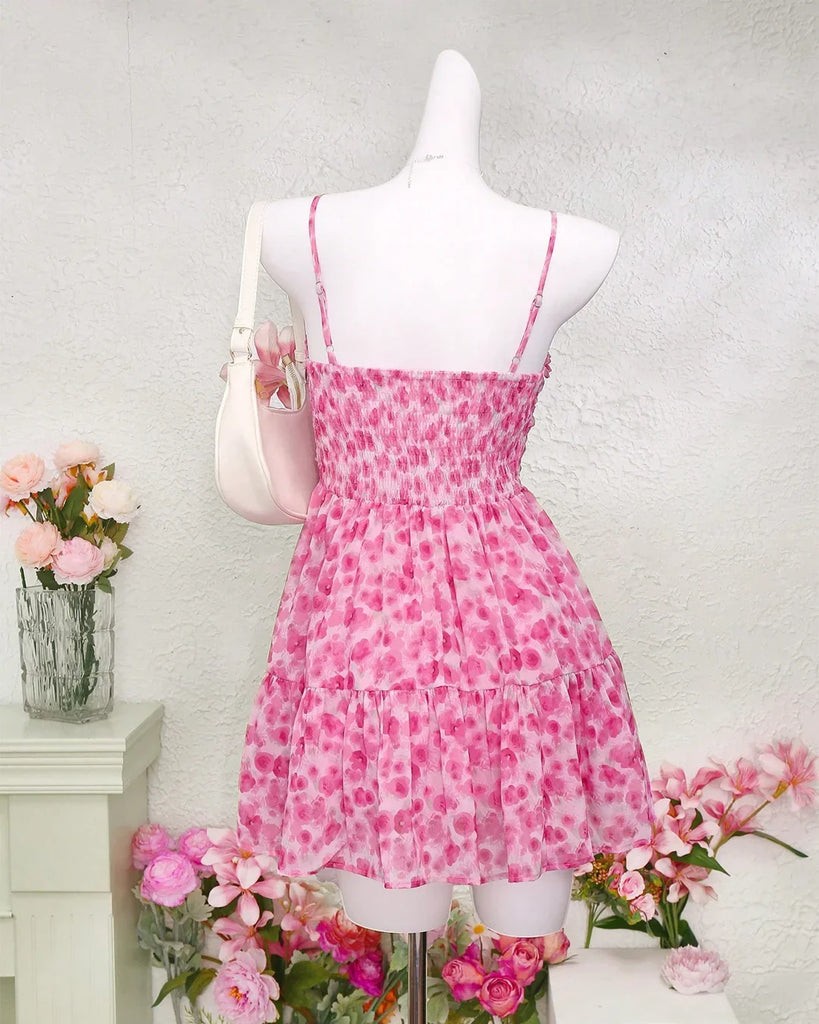 Back view of a Floral Mesh Fit & Flare Dress featuring a pink rose print design.
