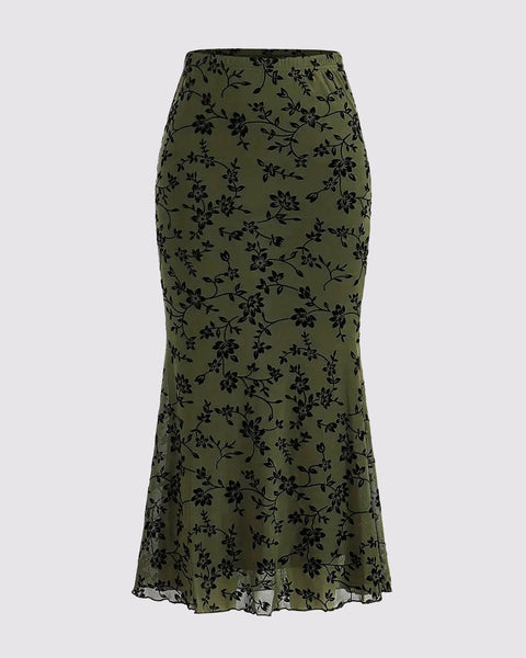 A stylish floral skirt featuring a low hem, perfect for a casual or dressy occasion