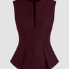 Front view of pleated top in maroon with half zip front and structured panels, featuring a fitted waist and flared hem for a sleek look