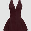 A burgundy halter neck mini dress featuring a buttoned neckline and A-line silhouette.