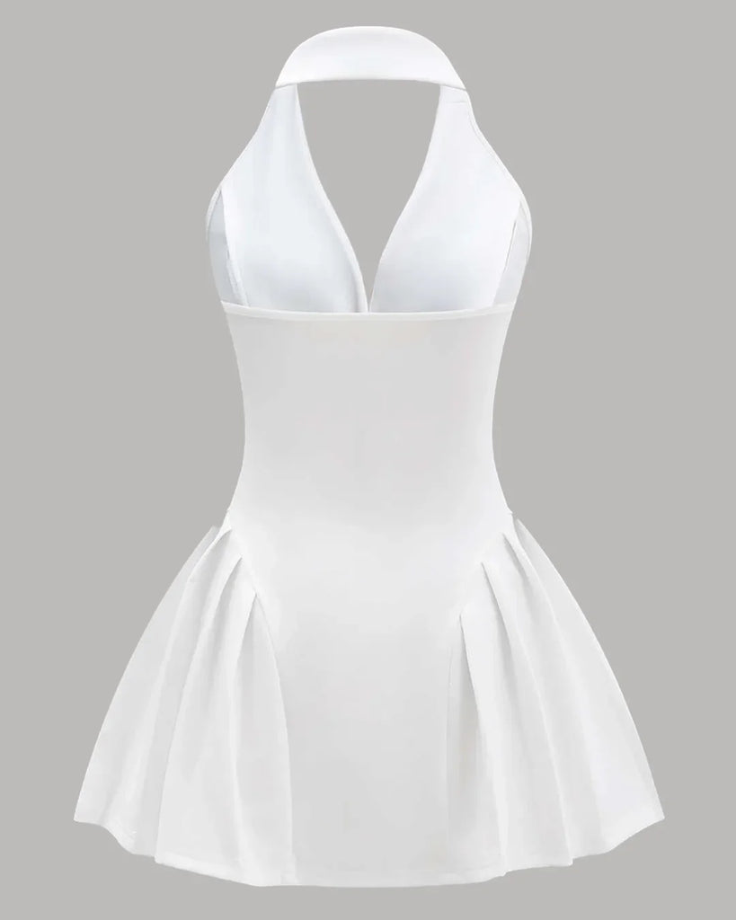 Back view of a Halter neck white A-line mini dress featuring a buttoned front design.
