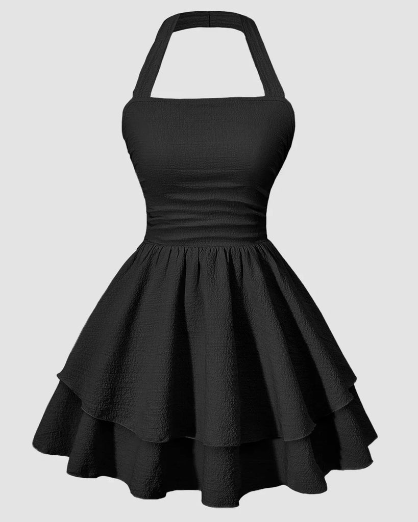 Black halter neck mini dress with a ruched waist and a tiered ruffled skirt, perfect for a stylish evening out.