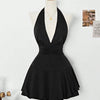 Front view of black halter neck mini dress with fitted bodice and flared skirt, elegant black halter dress.