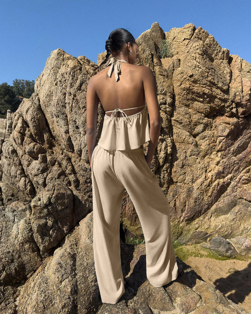 High-rise light khaki wide-leg trousers with a drawstring waist, designed for women's casual or formal wear.