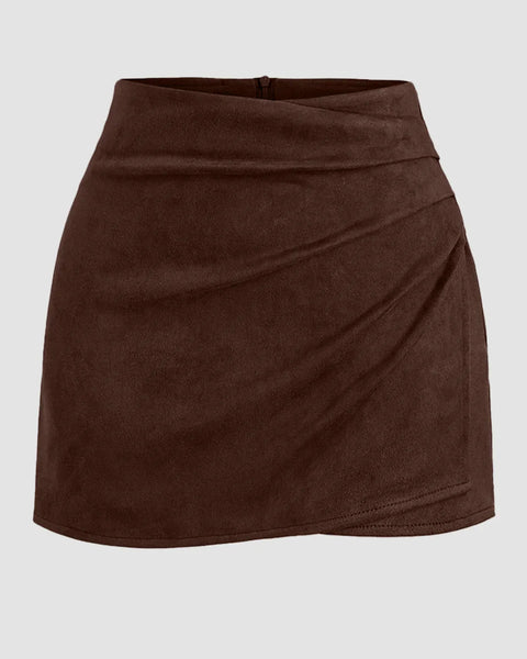 Front view of Brown wrap mini skirt with soft suede texture, overlapping front panel, and fitted waist for a chic casual look.