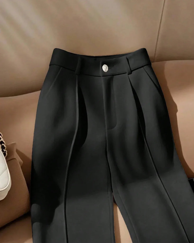 A pair of high-waist black front-slit tailored trousers