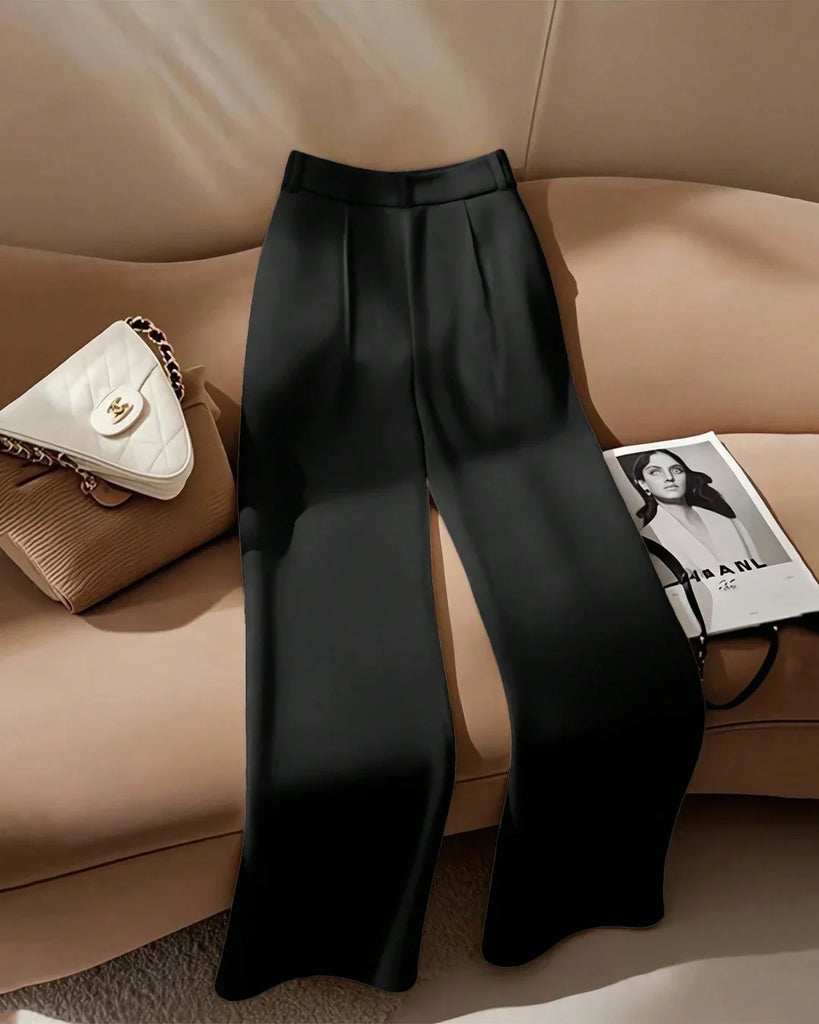 Back view of a pair of high-waist black front-slit tailored trousers