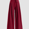 High-waist burgundy wide-leg trousers with pleats and tie-belt detail, designed for a stylish and comfortable fit.