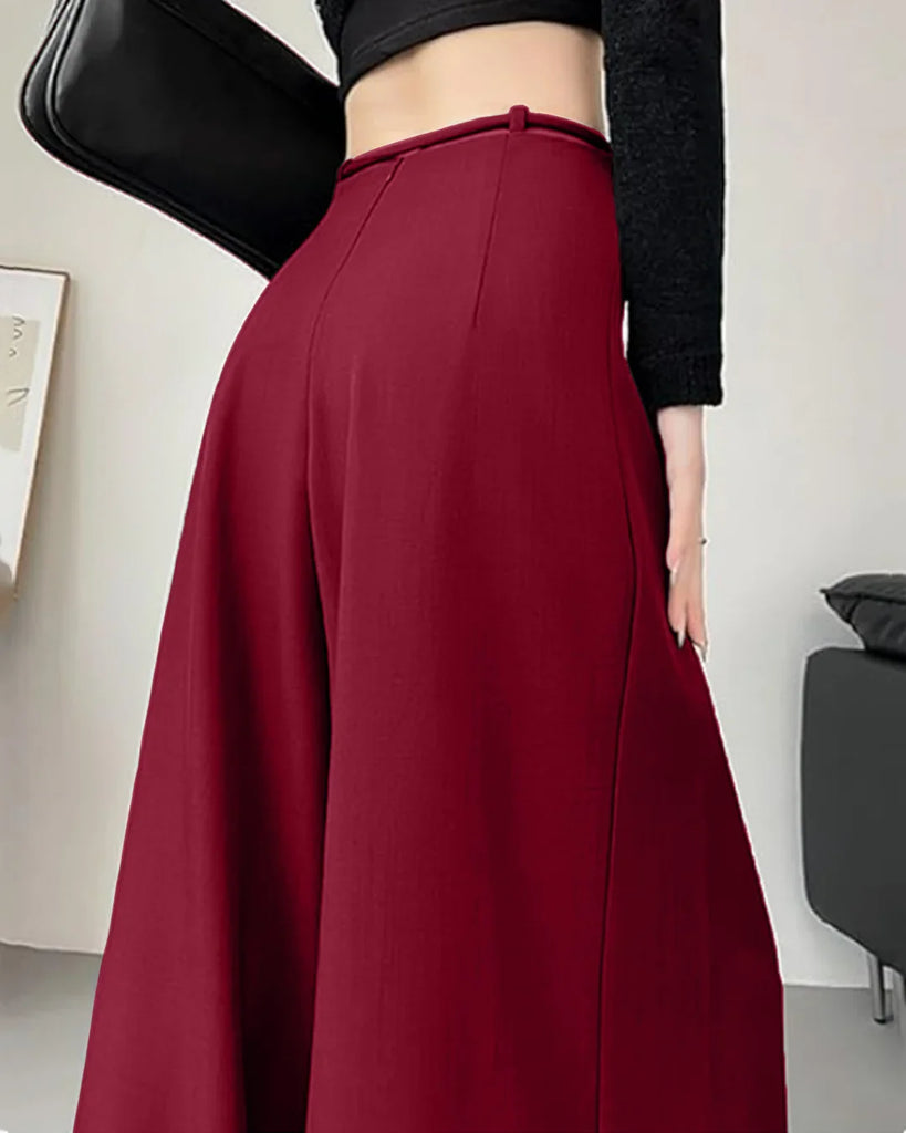 High-waist burgundy wide-leg trousers with pleats and tie-belt detail, designed for a stylish and comfortable fit.