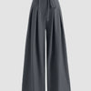 High-waist dark grey wide-leg trousers with a tie-belt and pleated design, suitable for casual or formal wear.