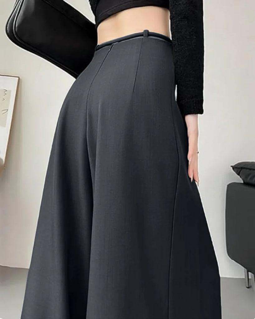 Back view of a High-waist dark grey wide-leg trousers with a tie-belt and pleated design, suitable for casual or formal wear.