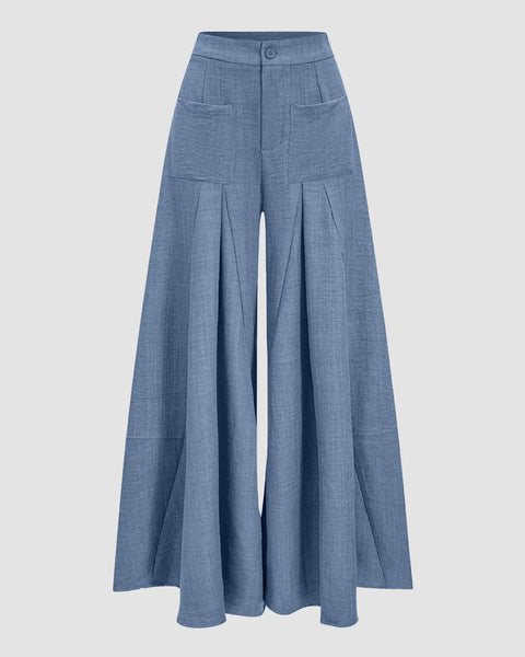 Front View of High waisted wide leg pants in French blue with pleated front, front pockets, and a soft textured full-length flowy fit.