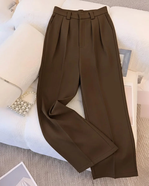 Front view of womens tailored trousers in brown with high waist, pleated front and straight leg silhouette.