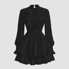Black high-neck dress featuring voluminous puff sleeves for a sophisticated, statement look.