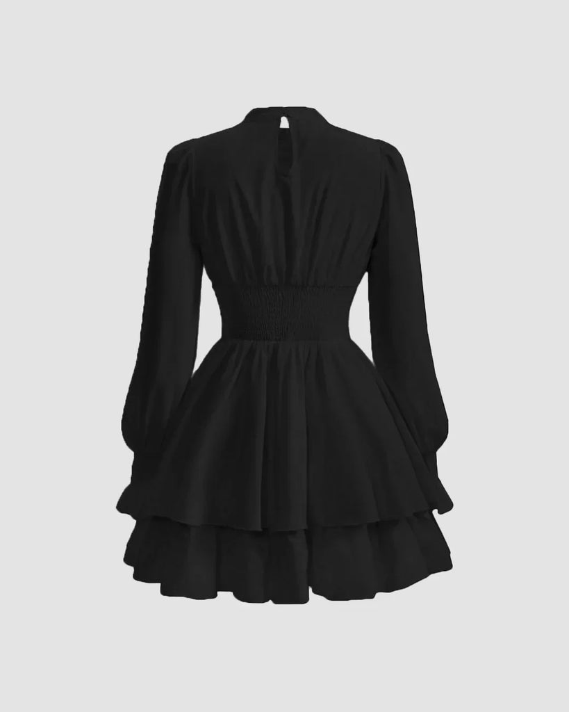 Back view of a Black high-neck dress featuring voluminous puff sleeves for a sophisticated, statement look.