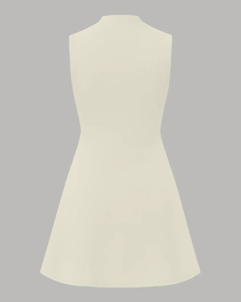 Back view of a High neck, sleeveless beige mini dress with ruched detailing and A-line silhouette.
