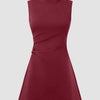 High neck, sleeveless burgundy mini dress with a ruched A-line design.