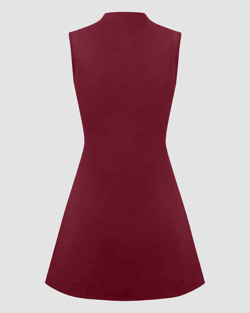 Back view of a High neck, sleeveless burgundy mini dress with a ruched A-line design.