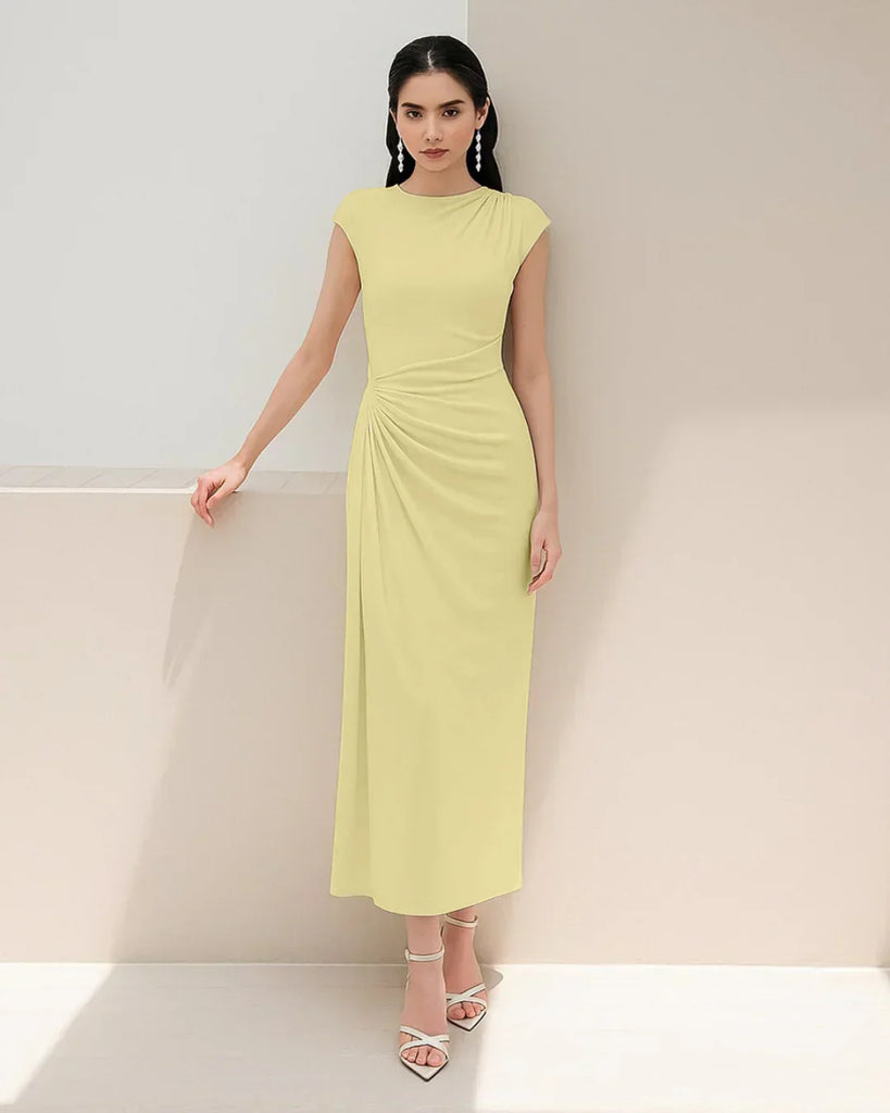 Women's yellow maxi dress with a ruched high neck and split design, styled in a solid twist design.
