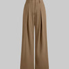 Front view of High rise Korean style brown trousers with pleated front, wide leg fit, smooth fabric, and full length silhouette.