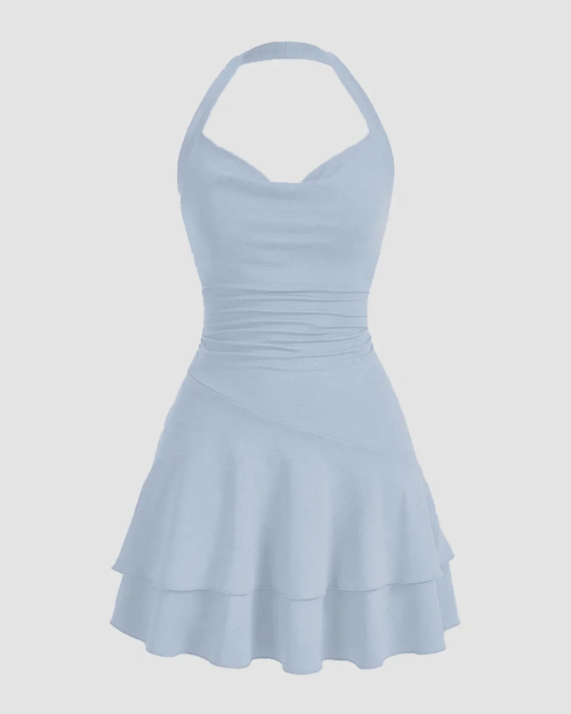 Light blue halter neck dress with a ruched bodice and a ruffled skater skirt, perfect for a summer outing.
