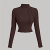 Brown knitted cropped top with long sleeves, featuring a soft texture and a stylish design in chocolate brown.