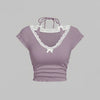 Front view of lace trim top in lilac with halter tie neck and short sleeves, featuring a fitted silhouette and soft feminine detailing