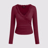 Front view of Maroon long-sleeved top with a V-neck, lace trim, and ruched design, showcasing elegant and stylish details