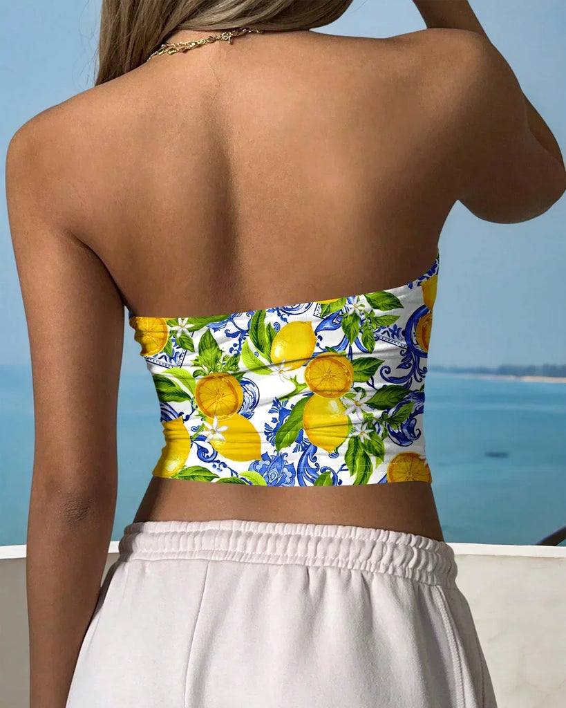 Blue and white strapless crop top featuring a lemon print pattern, perfect for summer fashion.