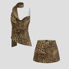 Front view of leopard print co ord set with cowl neck top, scarf detail and matching mini skirt for a bold look.