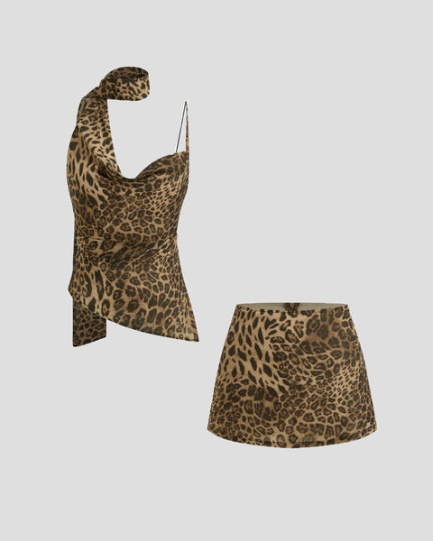 Front view of leopard print co ord set with cowl neck top, scarf detail and matching mini skirt for a bold look.